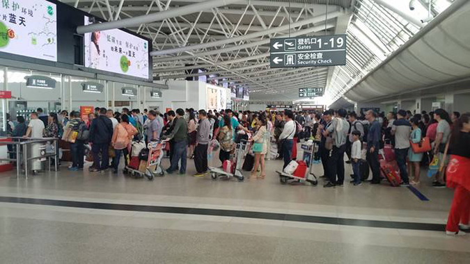 科技成果亮相春運安檢現場,人臉識別與掃碼齊上陣